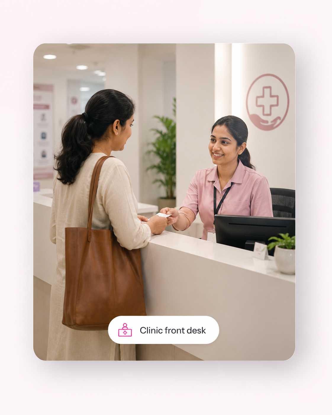 A patient speaking with a clinic front desk employee