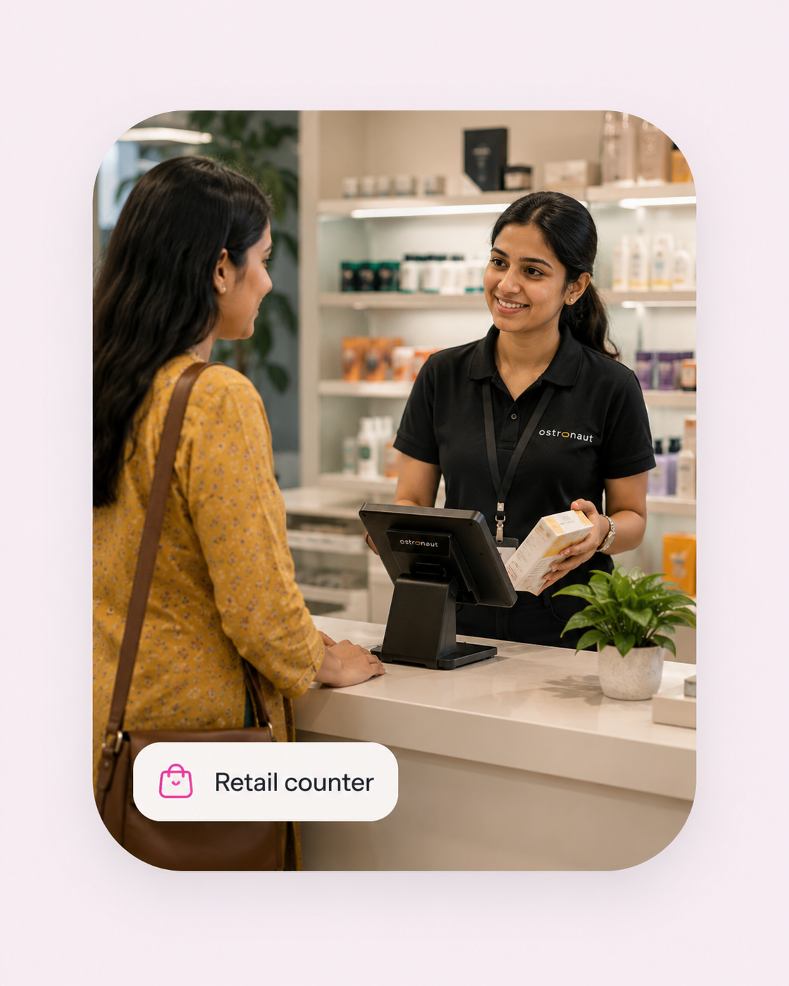A retail employee speaking with a customer at a counter